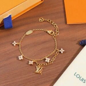 Louis Vuitton Gold Bracelet with White Flower Charms